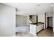 Open floor plan showcasing the living room adjacent to the kitchen area, complete with stairs leading to the next floor at 2352 Grand Central Pkwy # 18, Orlando, FL 32839