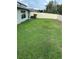 Large, fenced backyard featuring ample lawn space, perfect for outdoor activities and entertaining at 4160 Salt Springs Ln, Lakeland, FL 33811
