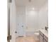 Clean bathroom featuring a shower-tub combo with white tiled walls and vanity with neutral-toned cabinets at 608 Terrapin Dr, Debary, FL 32713