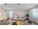 Bright living room offers comfortable seating, stylish decor, and plenty of natural light at 608 Terrapin Dr, Debary, FL 32713