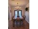 Cozy dining room with decorative chandelier and views to the exterior at 166 Catfish St, Haines City, FL 33844