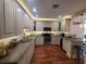 Bright kitchen with custom cabinetry, modern appliances, and hardwood floors at 166 Catfish St, Haines City, FL 33844