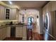 Open-concept kitchen with wine fridge flowing into a dining area at 166 Catfish St, Haines City, FL 33844