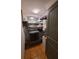 Functional laundry room with modern appliances and shelving for storage at 166 Catfish St, Haines City, FL 33844