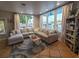 Bright living room featuring a large sectional sofa, area rug, and stunning waterfront views at 166 Catfish St, Haines City, FL 33844