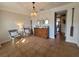 Inviting living room features a wooden dresser, decorative mirrors, and rustic paddles at 166 Catfish St, Haines City, FL 33844