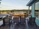 Outdoor seating area overlooking a serene waterfront and neighboring docks at 166 Catfish St, Haines City, FL 33844