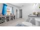 Well-lit bathroom featuring a vanity with granite countertop, tiled flooring, and a modern toilet for added convenience at 1065 Mattie Pointe Way, Auburndale, FL 33823