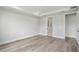 Neutral bedroom with hardwood floors, recessed lighting, and ample natural light at 2797 Top Hill Ct, Minneola, FL 34715