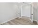 Stylish bedroom with wood-look floors and glass doors at 2797 Top Hill Ct, Minneola, FL 34715
