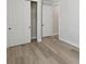Bedroom featuring a closet with sliding doors and hardwood floors, offering ample storage at 2797 Top Hill Ct, Minneola, FL 34715