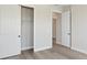 Bedroom featuring a closet with sliding doors and hardwood floors, offering ample storage at 2797 Top Hill Ct, Minneola, FL 34715