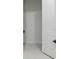Walk-in closet view featuring an open door and shelving in a bright, clean space at 2797 Top Hill Ct, Minneola, FL 34715