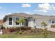 Beautiful single-story house with lush landscaping and a paver driveway at 2797 Top Hill Ct, Minneola, FL 34715