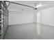 A large and spacious garage features sealed concrete floors at 2797 Top Hill Ct, Minneola, FL 34715
