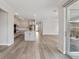Spacious living area showcases hardwood floors, lots of light and a connection to outdoor living at 2797 Top Hill Ct, Minneola, FL 34715