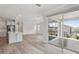 Open floor plan with hardwood floors, and seamless flow from kitchen to living room and outdoor patio at 2797 Top Hill Ct, Minneola, FL 34715