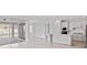 Spacious open floorplan with a kitchen featuring stainless steel appliances and a living area with sliding glass doors at 2797 Top Hill Ct, Minneola, FL 34715