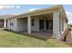 Enjoy this covered brick patio that leads to a grassy backyard at 2797 Top Hill Ct, Minneola, FL 34715