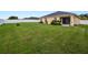 Expansive backyard featuring a well-maintained lawn and white fence, perfect for outdoor activities at 4662 Harts Brook Ln, Mulberry, FL 33860