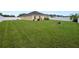 Well-maintained, fenced backyard with a lush, green lawn at 4662 Harts Brook Ln, Mulberry, FL 33860