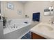 Bathroom featuring soaking tub and double sink vanity at 4662 Harts Brook Ln, Mulberry, FL 33860