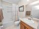 Bathroom features a combined tub and shower, updated vanity and fixtures at 4662 Harts Brook Ln, Mulberry, FL 33860