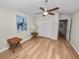Bedroom showcasing wood-look floors, ceiling fan, closet and pelican art at 4662 Harts Brook Ln, Mulberry, FL 33860