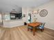 Dining area showcasing hardwood flooring and access to kitchen at 4662 Harts Brook Ln, Mulberry, FL 33860