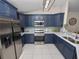 Updated kitchen features stainless steel appliances, custom cabinets, and breakfast bar at 4662 Harts Brook Ln, Mulberry, FL 33860