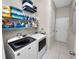 Well-organized laundry room with shelving and modern appliances at 4662 Harts Brook Ln, Mulberry, FL 33860