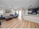 Open concept living room showcasing hardwood floors and backyard views at 4662 Harts Brook Ln, Mulberry, FL 33860