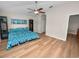 Spacious main bedroom featuring hardwood floors and ample closet space at 4662 Harts Brook Ln, Mulberry, FL 33860