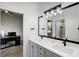 Modern bathroom with double sinks, updated fixtures, and a large mirror, providing a luxurious and functional space at 655 Whisper Woods Dr, Lakeland, FL 33813