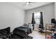 This bedroom features a comfortable bed, a well-lit window, and a dedicated workspace, perfect for relaxation and productivity at 655 Whisper Woods Dr, Lakeland, FL 33813