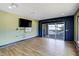 Spacious bonus room featuring a sliding glass door and stylish decor with nautical accents at 655 Whisper Woods Dr, Lakeland, FL 33813