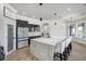 Spacious kitchen features a large center island with seating and modern stainless steel appliances at 655 Whisper Woods Dr, Lakeland, FL 33813