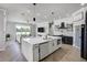 Modern kitchen featuring a large center island with seating and an open layout concept at 655 Whisper Woods Dr, Lakeland, FL 33813
