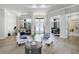 Inviting living room featuring high ceilings, wood floors, and an abundance of natural light at 655 Whisper Woods Dr, Lakeland, FL 33813