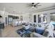 Open-concept living room featuring wood floors, modern decor, and stylish furnishings at 655 Whisper Woods Dr, Lakeland, FL 33813