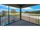 Screened patio with beautiful golf course view, with a glimpse of a pool below, perfect for outdoor relaxation at 655 Whisper Woods Dr, Lakeland, FL 33813
