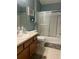 Well-maintained bathroom with vanity, and bathtub/shower combination at 1087 Jackson St, The Villages, FL 32162