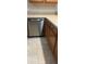 Kitchen featuring stainless steel dishwasher, wooden cabinets and light countertops at 1087 Jackson St, The Villages, FL 32162