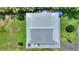 Detailed aerial view of home featuring gray roof and surrounding green landscaping at 1395 S Lake Reedy Blvd, Frostproof, FL 33843