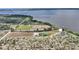 Scenic aerial view of a sprawling property, showing proximity to a large lake at 1395 S Lake Reedy Blvd, Frostproof, FL 33843