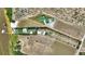 Aerial view of farm, home, and pool with dock on water at 1395 S Lake Reedy Blvd, Frostproof, FL 33843