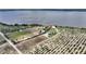 Wide aerial view of a house near a lake with ample land, illustrating a peaceful setting at 1395 S Lake Reedy Blvd, Frostproof, FL 33843