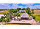 Waterfront property featuring a tiki hut, lounge area, and private dock offers an idyllic outdoor living experience at 1395 S Lake Reedy Blvd, Frostproof, FL 33843