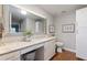 Bright bathroom features white cabinets, quartz countertops, and wood floors at 1395 S Lake Reedy Blvd, Frostproof, FL 33843