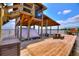 Covered boat dock with boat lift, seating area, and waterfront views at 1395 S Lake Reedy Blvd, Frostproof, FL 33843